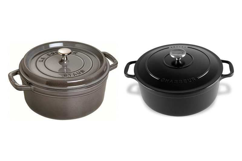 A graphite Staub round cocotte and a matte black Chasseur French oven, both enamelled cast iron